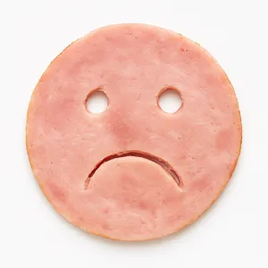 Sad ham face with droopy eyes and frown