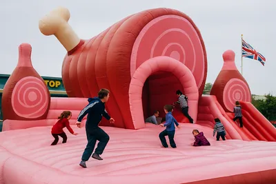 Giant ham-shaped bouncy castle with spiral pattern